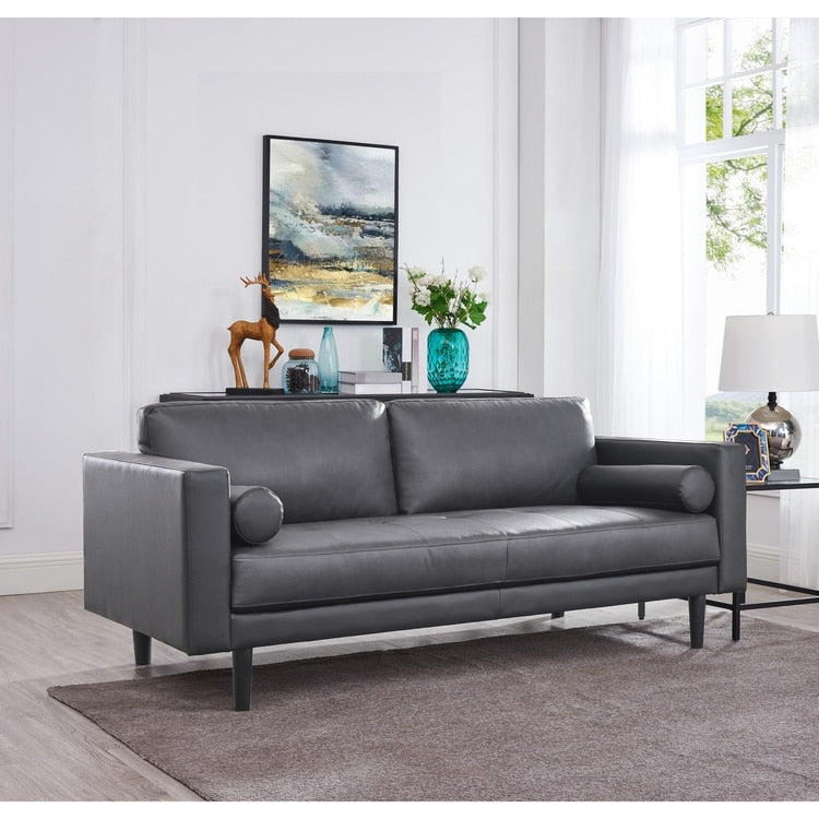 Canapé moderne en cuir véritable avec pieds en bois et coussin supplémentaire.