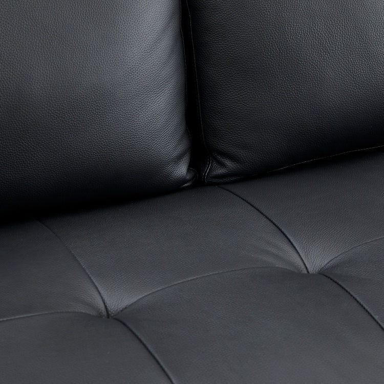 Canapé moderne en cuir véritable avec pieds en bois et coussin supplémentaire.