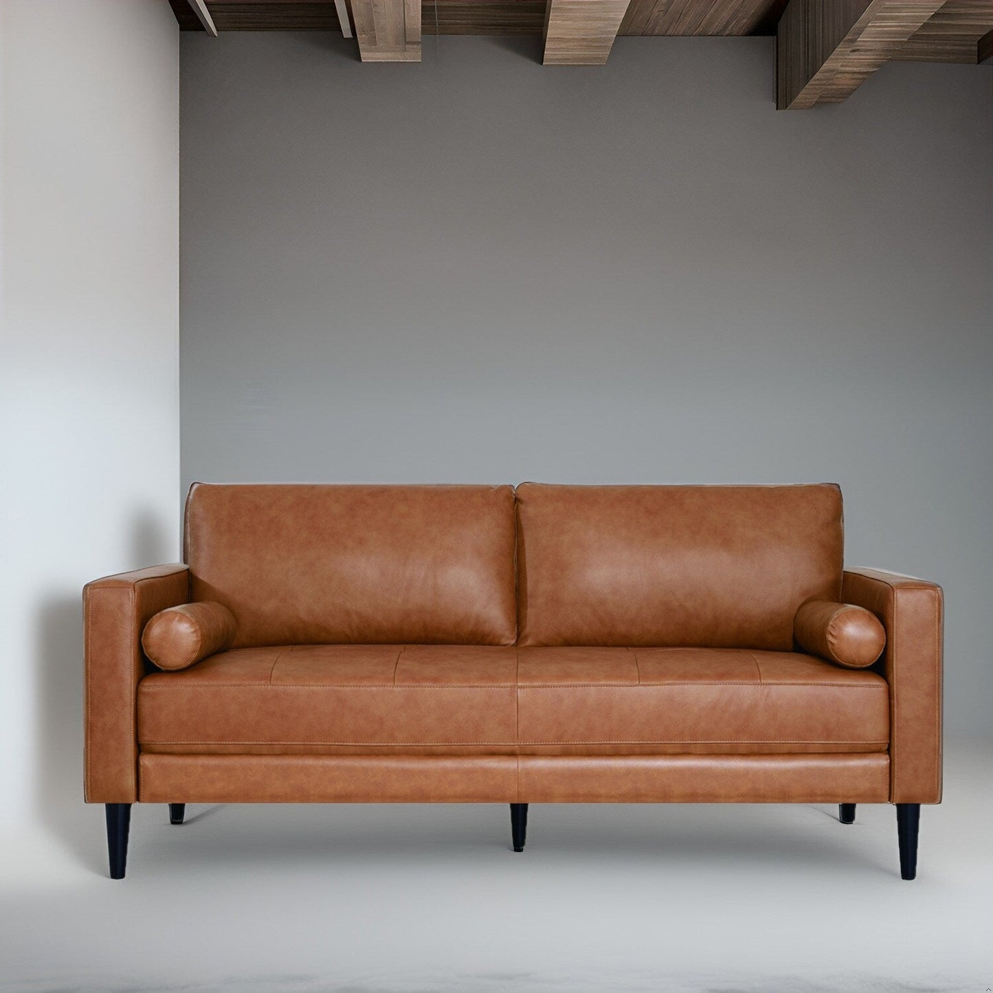 Canapé moderne en cuir véritable avec pieds en bois et coussin supplémentaire.