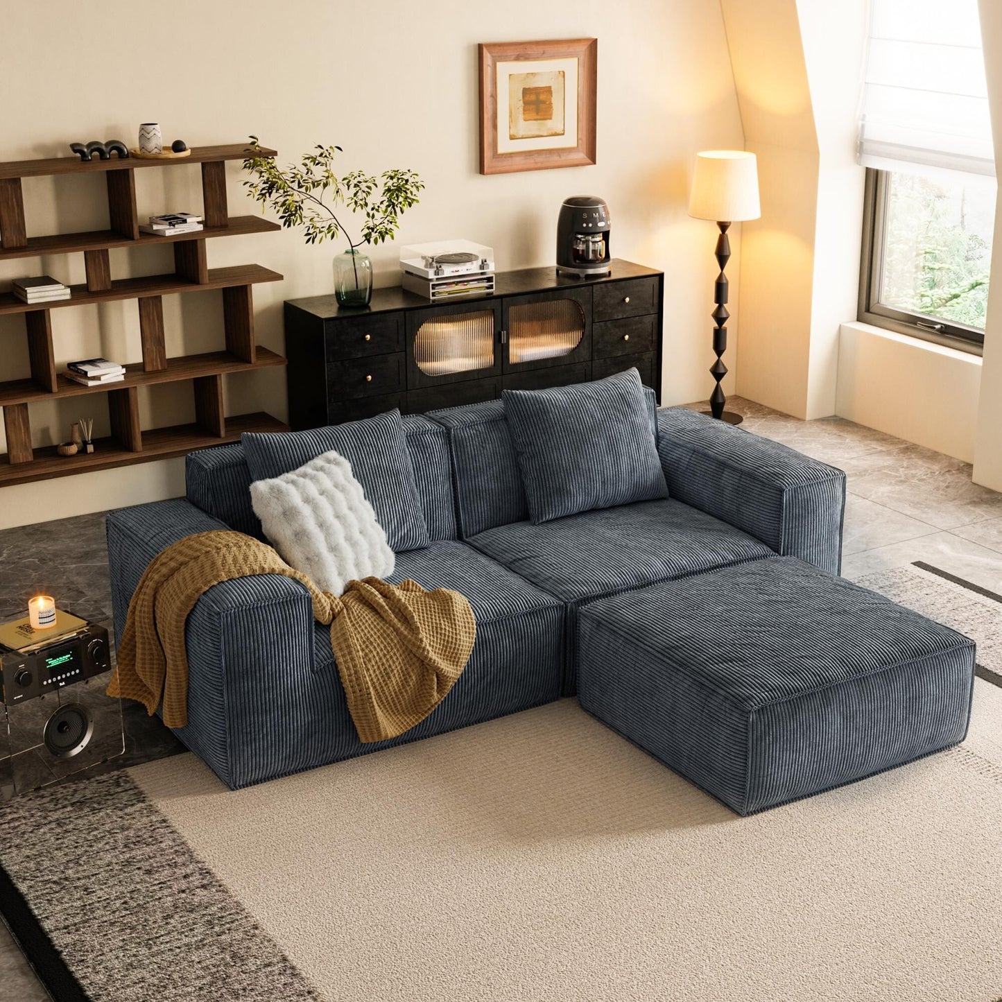 Canapé-lit convertible modulaire 2 places en velours corduroy gris.
