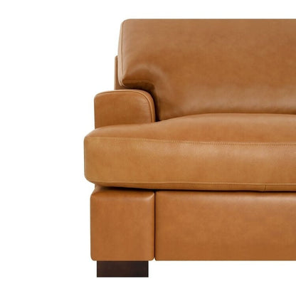 Canapé moderne en cuir véritable avec pieds en bois et coussin supplémentaire.