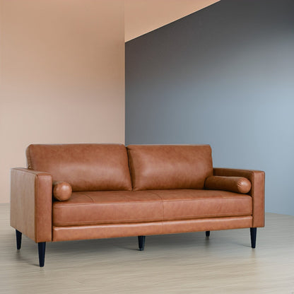 Canapé moderne en cuir véritable avec pieds en bois et coussin supplémentaire.