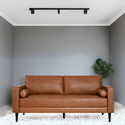 Canapé moderne en cuir véritable avec pieds en bois et coussin supplémentaire.