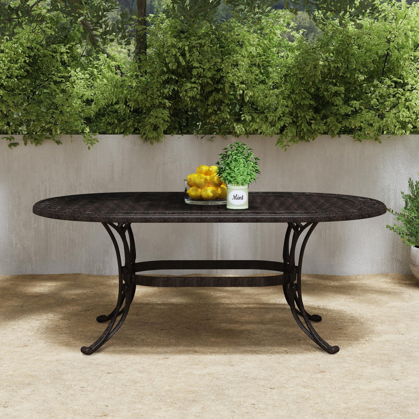 Ensemble de salle à manger d'extérieur Sanibel en bronze et aluminium, 7 pièces, comprenant une table ovale de 72 pouces et six chaises à accoudoirs de Homestyles.