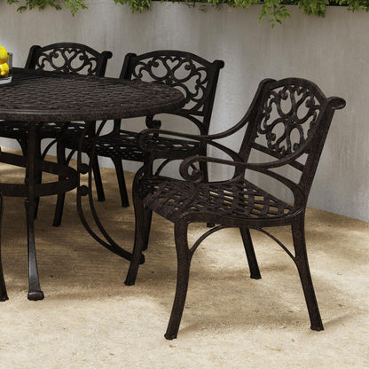 Ensemble de salle à manger d'extérieur Sanibel en bronze et aluminium, 7 pièces, comprenant une table ovale de 72 pouces et six chaises à accoudoirs de Homestyles.